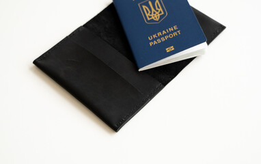 Ukrainian biometric passport id with a genuine leather cover on a white background.