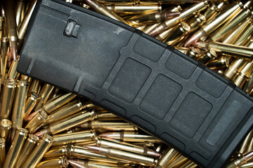 Rifle magazine and cartridges, close-up photo.