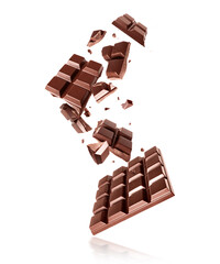 Whole and broken dark chocolate bars in the air on a white background