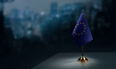 Small national flag of the European Union on a black background - obrazy, fototapety, plakaty
