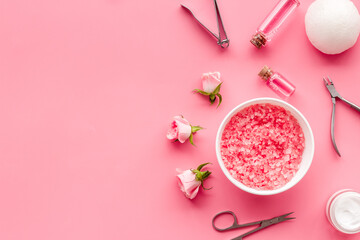 Manicure set with roses water in bowl. Herbal hands care cosmetic set.