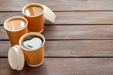 Fototapeta na wymiar Coffee to go in many paper cups. Takeaway coffee