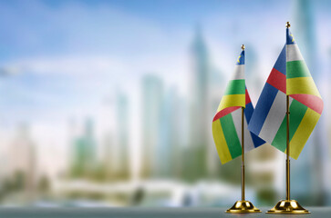 Small flags of the Central African Republic on an abstract blurry background