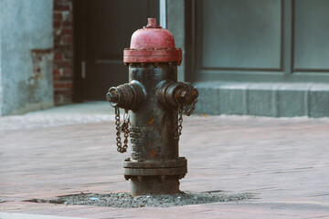 old shabby rusty hydrant on the street