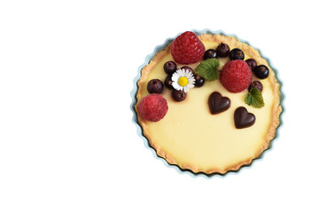 Shortbread vanilla tartlet with fruits, two chocolate hearts, edible daisy flower and lemon balm...