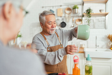 happiness cheerful asian multi generation family preparing healthy smoothie juice drink together at...