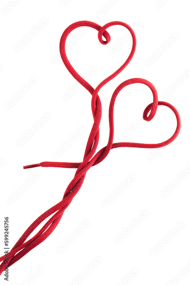 Wall mural red shoe lace in a shape of two hearts against white background.