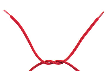red shoe laces with a knot against white background © Nikola Spasenoski