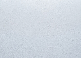 Rough, jagged surface marks of cement surface or concrete wall painted white. White cement wall for use as a background or wallpaper.