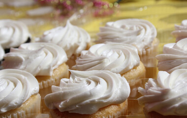 Cupcakes With White Icing on Table at Party or Event