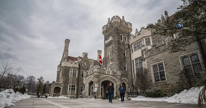 time lapse of main entrance of casa loma with tourists