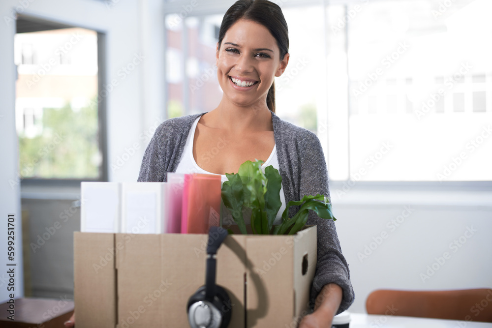 Poster Pleased with her climb up the ladder of success. Portrait of an attractive young woman moving into a new office.