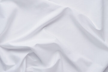 White fabric. luxurious white fabric texture background. Creases of satin, silk and cotton.