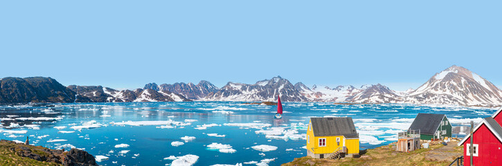 A yacht with red sails in motion -    Panoramic view of colorful Kulusuk village in East Greenland - Kulusuk, Greenland - Melting of a iceberg and pouring water into the sea