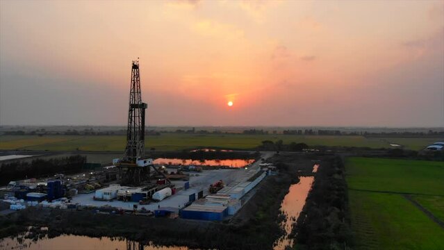 High angle view oil drilling rig in the rice field