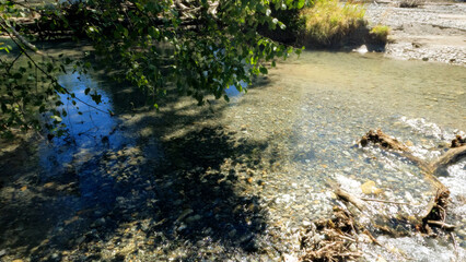 Obraz na płótnie Canvas tiny clear cold stream with beach stones in Arkhyz mountains - photo of nature