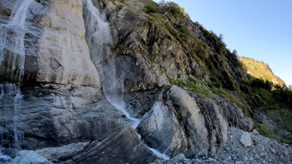 beautiful mountain ridge high land fast waterfall at summertime day - photo of nature