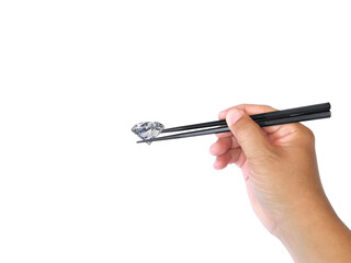 new idea concept male hand with chopsticks holds dazzling diamond. on transparent background