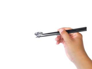 new idea concept male hand with chopsticks holds dazzling diamond. on transparent background
