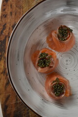 black caviar in red fish serving