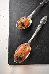 black caviar in red fish serving