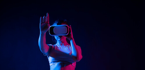 Modern architect, designer woman wearing VR goggles and interacts with metaverse using swipe and stretching gestures. Future technology concept.