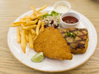 Fish and chips with grilled chicken spicy steak
