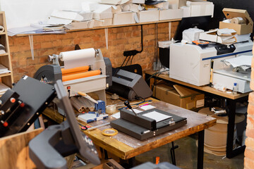 modern paper trimmer and professional print plotter machine in print center.