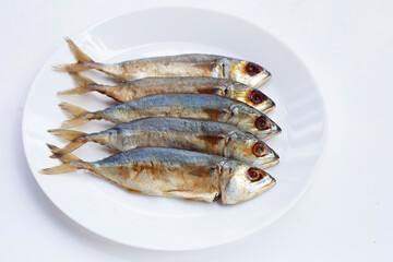 Salted fish on white background.