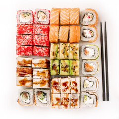 Big colorful sushi set on a white background. Top view.