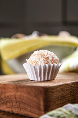 Brazilian party sweets beijinho de coco. Closeup.