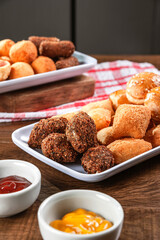 Various brazilian snacks deep fried. (Coxinha, kibe, empadinha e risolis).