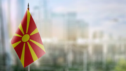 Small flags of the Macedonia on an abstract blurry background