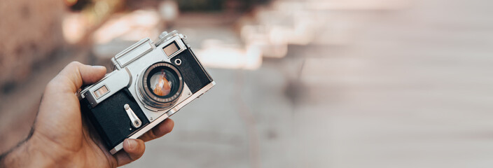 Vintage camera in hand