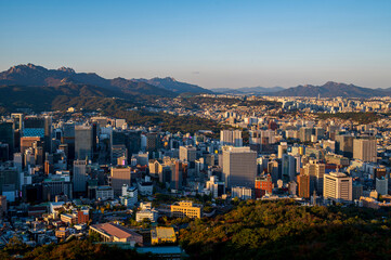 sunset of Seoul cityscapes with high rise office buildings and skyscrapers in Seoul city, Republic of Korea in winter blue sky and cloud
