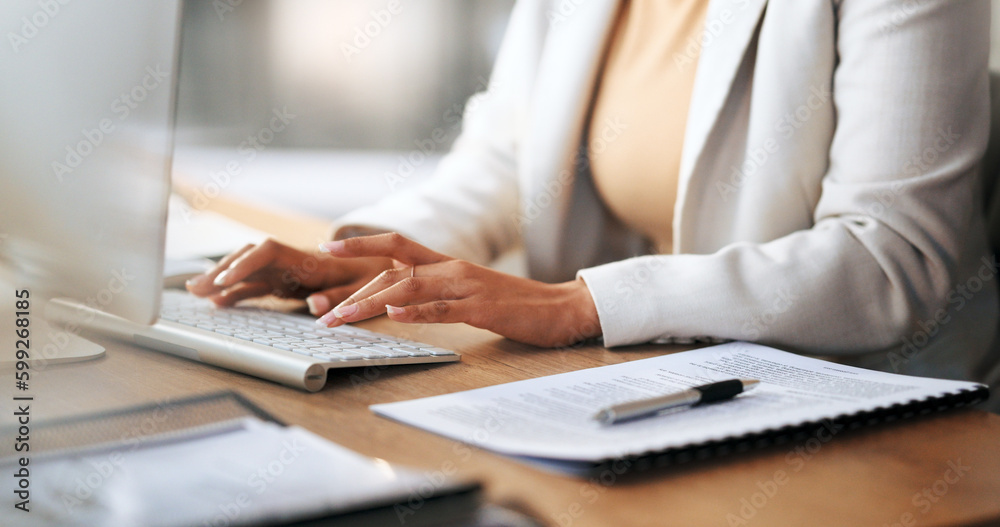 Poster Closeup of the hands of a receptionist typing and sending emails while working in an office alone. One secretary doing admin and writing reports while organizing a schedule for her manager at work