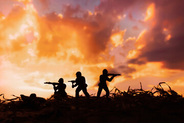 war concept, Miniature toy soldiers in  battle scene.