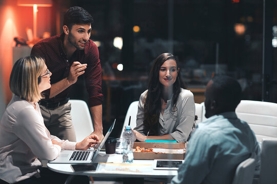 Going the extra mile makes things happen. colleagues having a meeting during a late night in a modern office.