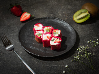 Fast food collection. Rolls with strawberries and kiwi on a dark background. Photo for fast food cafe menu, restaurant