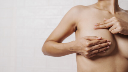 Young asian woman examining breast mastopathy or signs of breast cancer, Closeup Sexy Topless Naked...