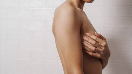 Young asian woman examining breast mastopathy or signs of breast cancer, Closeup Sexy Topless Naked Female With Breast Cancer Awareness © M+Isolation+Photo