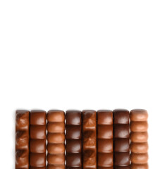 Chocolate bars sticks on white background, top view, copy space