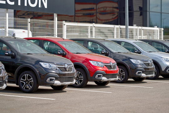Minsk, Belarus. Apr 2023. Renault cars fleet parked in row outdoors. New Renault car for sale. Parking lot close to authorized dealership building Renault.close to dealer building