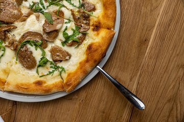 delicious italian pizza on a wooden table
