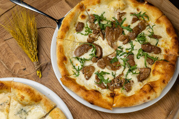 delicious italian pizza on a wooden table
