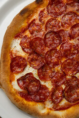 delicious italian pizza on a wooden table
