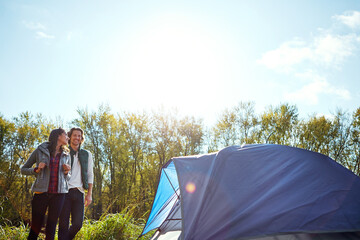 Its just beautiful out here. an adventurous young couple at their campsite.