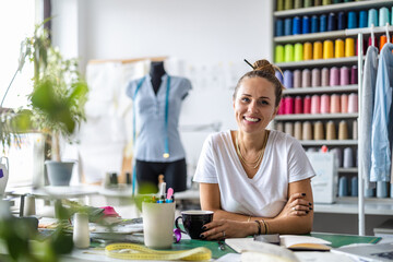 Young fashion designer at her workplace
