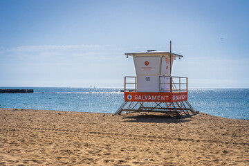 Barcelona Spain beach with a lifeguard tower and clear blue sky