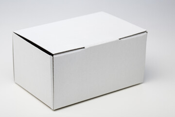 White cardboard box. Small recyclable container.